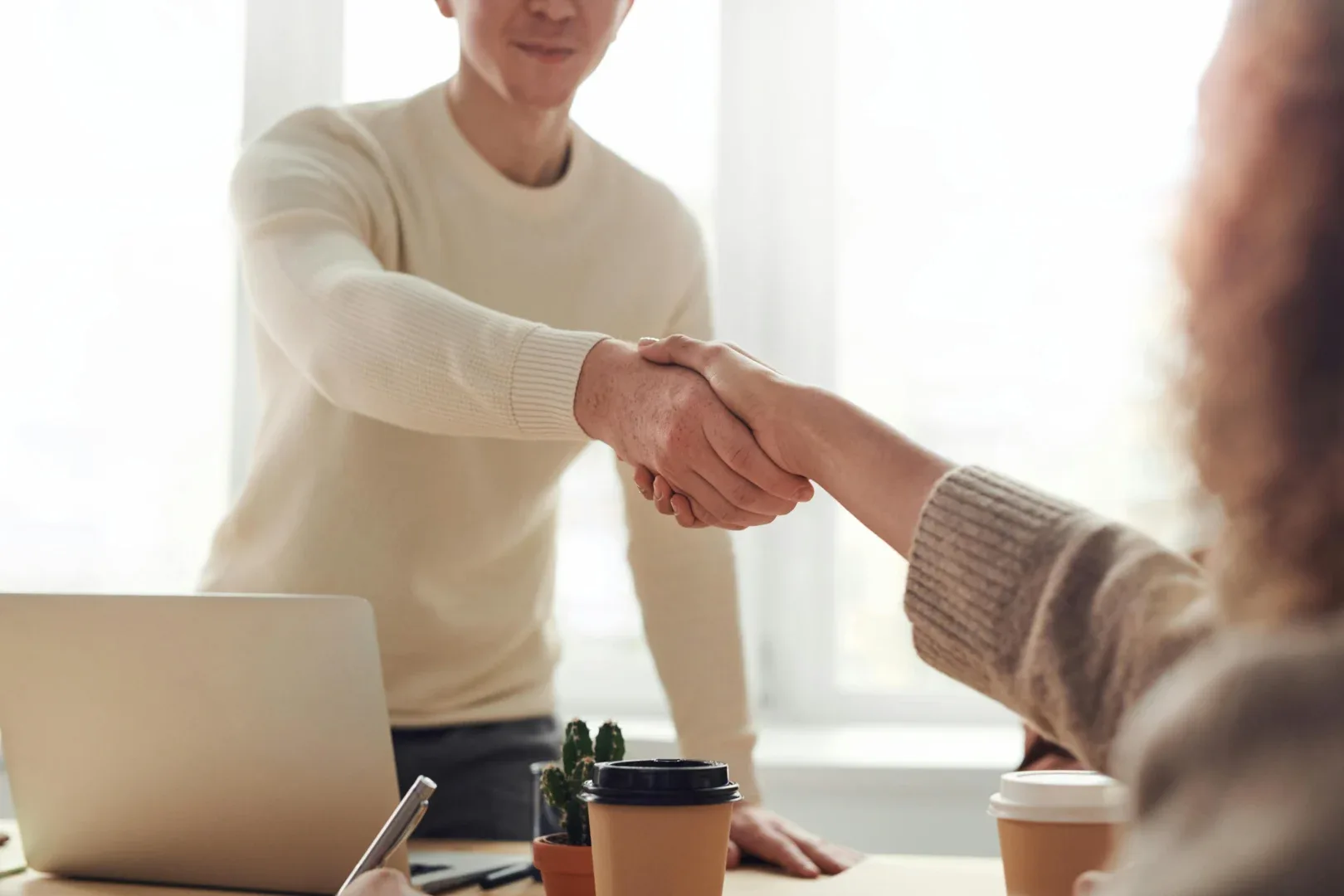 a man shaking hands with another man